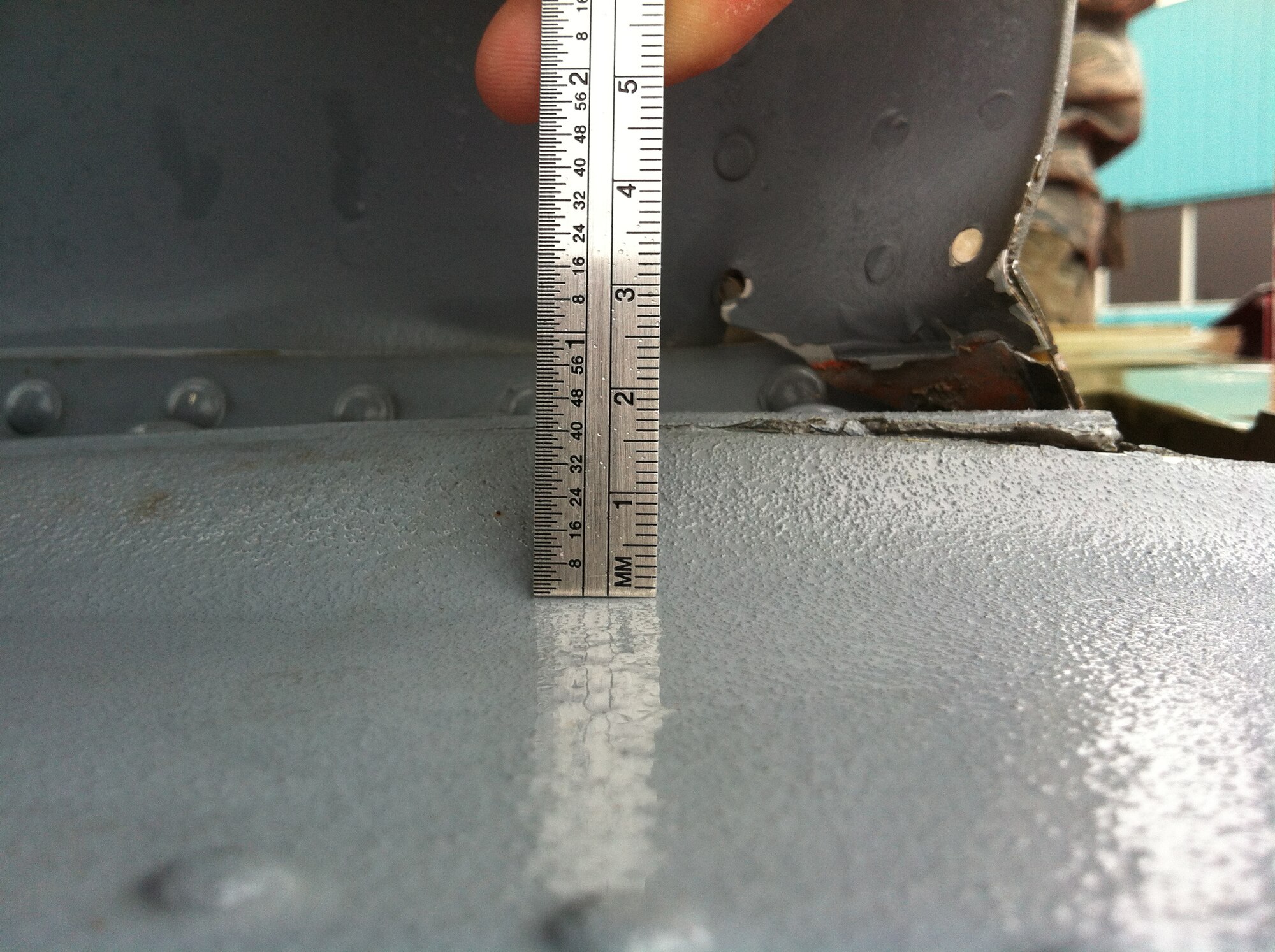 Taking precise measurements is paramount to ensuring aircraft flight safety.  1st Lt. Eric Yerly, a depot liaison engineer deployed to Southwest Asia gives an example of how a small measurement can make a huge difference.  “One eighth of an inch doesn’t sound like a lot right,” said Yerly.  “But 1/8 of an inch to a 3/32 rivet is a lot.  The thickness of a part, its size, what it’s made out of, how it’s installed…all those things play into the safety of the airplane.  So if you install a rivet and you don’t squeeze it fully, it doesn’t fill the hole all the way, so it vibrates a little bit.  Well the vibration over time creates a crack which causes the rivet to fall out which makes the two pieces that it was holding together loose.  You lose one rivet and you don’t have a large enough, what we call margin of safety, it can actually cause all the other rivets to fail and it can actually cause the aircraft to crash.”  (Courtesy photo)