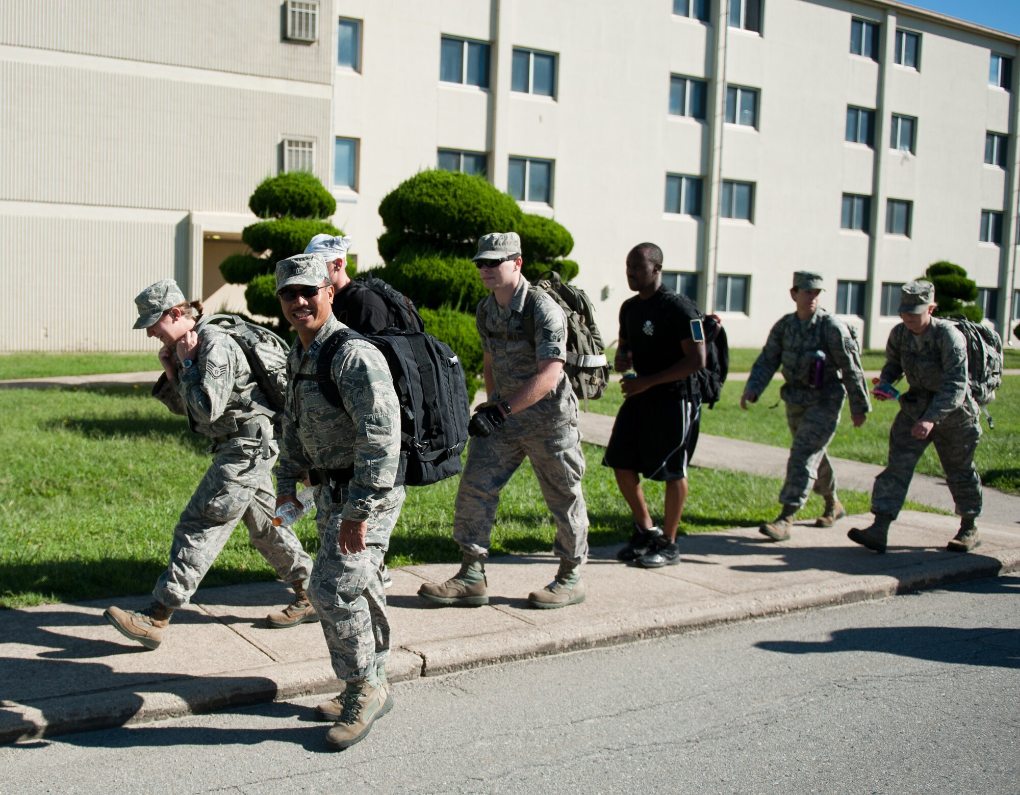 Wolf Pack Airmen take part in the Kunsan Prisoner of War and Missing In Action Ruck March at Kunsan Air Base, Republic of Korea, Sept. 16, 2013. Every Airman participating carried a rucksack weighing at least 40 pounds while marching five miles around the base. (U.S. Air Force photo by Senior Airman Clayton Lenhardt/Released)