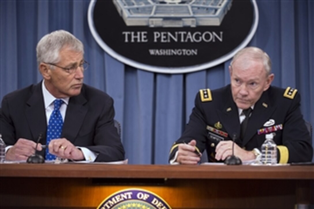 Secretary of Defense Chuck Hagel and Chairman of the Joint Chiefs of Staff Gen. Martin E. Dempsey conduct a press conference at the Pentagon in Arlington, Va., on Sept. 18, 2013.  Hagel and Dempsey fielded questions about the Navy Yard shooting and the situation in Syria.  