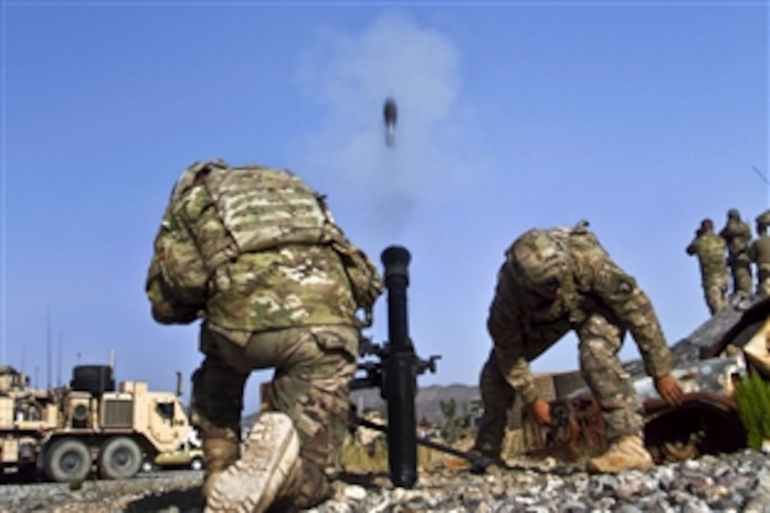U.S. Army Spcs. Adam L. Cayton, and Sheign K. Hopson fire a 81mm mortar system during a live-fire training exercise on Afghan Combat Outpost Kaligu in Paktya province, Afghanistan, Sept. 12, 2013. Cayton and Hopson, indirect fire infantrymen, are assigned to the 101st Airborne Division's 1st Battalion, 506th Infantry Regiment, 4th Brigade Combat Team.