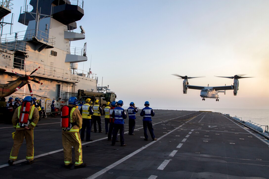 An MV-22B Osprey assigned to Marine Medium Tiltrotor Squadron (VMM) 226 (Reinforced), 26th Marine Expeditionary Unit (MEU), lands on the flight deck of the HMS Illustrious (R06), at sea, Sept. 16, 2013. The 26th MEU is a Marine Air-Ground Task Force forward-deployed to the U.S. 5th and 6th Fleet areas of responsibility aboard the Kearsarge Amphibious Ready Group serving as a sea-based, expeditionary crisis response force capable of conducting amphibious operations across the full range of military operations. (U.S. Marine Corps photograph by Cpl. Kyle N. Runnels/Released)