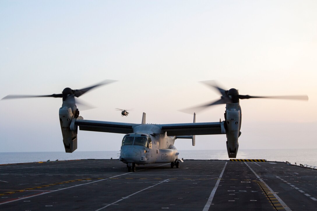 An MV-22B Osprey assigned to Marine Medium Tiltrotor Squadron (VMM) 226 (Reinforced), 26th Marine Expeditionary Unit (MEU), lands on the flight deck of the HMS Illustrious (R06), at sea, Sept. 16, 2013. The 26th MEU is a Marine Air-Ground Task Force forward-deployed to the U.S. 5th and 6th Fleet areas of responsibility aboard the Kearsarge Amphibious Ready Group serving as a sea-based, expeditionary crisis response force capable of conducting amphibious operations across the full range of military operations. (U.S. Marine Corps photograph by Cpl. Kyle N. Runnels/Released)