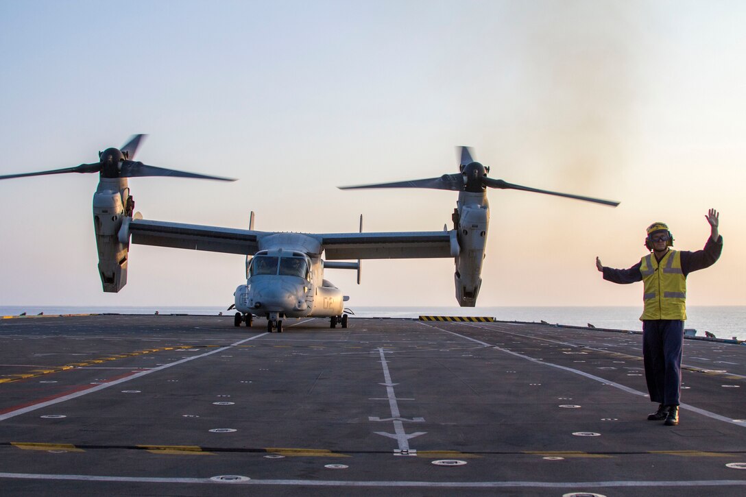 An MV-22B Osprey assigned to Marine Medium Tiltrotor Squadron (VMM) 226 (Reinforced), 26th Marine Expeditionary Unit (MEU), lands on the flight deck of the HMS Illustrious (R06), at sea, Sept. 16, 2013. The 26th MEU is a Marine Air-Ground Task Force forward-deployed to the U.S. 5th and 6th Fleet areas of responsibility aboard the Kearsarge Amphibious Ready Group serving as a sea-based, expeditionary crisis response force capable of conducting amphibious operations across the full range of military operations. (U.S. Marine Corps photograph by Cpl. Kyle N. Runnels/Released)
