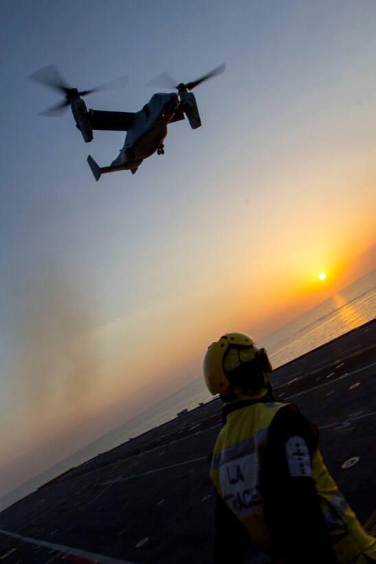 An MV-22B Osprey assigned to Marine Medium Tiltrotor Squadron (VMM) 226 (Reinforced), 26th Marine Expeditionary Unit (MEU), takes off from the flight deck of the HMS Illustrious (R06), at sea, Sept. 16, 2013. The 26th MEU is a Marine Air-Ground Task Force forward-deployed to the U.S. 5th and 6th Fleet areas of responsibility aboard the Kearsarge Amphibious Ready Group serving as a sea-based, expeditionary crisis response force capable of conducting amphibious operations across the full range of military operations. (U.S. Marine Corps photograph by Cpl. Kyle N. Runnels/Released)