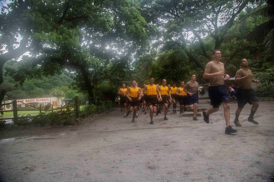 U.S. and Philippine Marines conduct physical training during Amphibious Landing Exercise 2014 (PHIBLEX 14) at Marine Barracks Gregorio Lim, Ternate, Cavite, Republic of the Philippines, Sept. 18, 2013. PHIBLEX is a bilateral training exercise that demonstrates the commitment of the United States and Republic of the Philippines to mutual security and their long-term partnership. It also ensures the readiness of a bilateral force to rapidly respond to regional humanitarian crises. The U.S. Marines are with Force Reconnaissance Platoon, Maritime Raid Force, 13th Marine Expeditionary Unit. The Philippine Marines are with Force Reconnaissance Battalion. (U.S. Marine Corps photo by Sgt. Ammon W. Carter, 13th Marine Expeditionary Unit Combat Camera/Released)