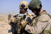 Marines assigned to Special Operations Task Force-West in Herat province, Afghanistan, review images taken by the team during an area assessment. Warfighters will benefit from the Distributed Common Ground/Surface System, which provides the Marine intelligence analyst capabilities for enterprise search, content discovery, collaboration and workflow management.