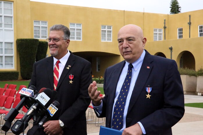 Robert T. Moffatt, Bronze Star Medal with combat distinguishing device recipient (left), and Joe B. Cordileone, Silver Star medal recipient (right), speak to the media during a press conference after a morning colors ceremony aboard Marine Corps Recruit Depot San Diego, Sept. 20. Both men were awarded their medals for their actions during the first Battle of Khe Sanh on April 30, 1967 while serving with Company M, 3rd Battalion, 3rd Marine Regiment, 3rd Marine Division. “Take care of each other,” said Cordileone.  “We’re family. We’re brothers. Never leave one behind.”