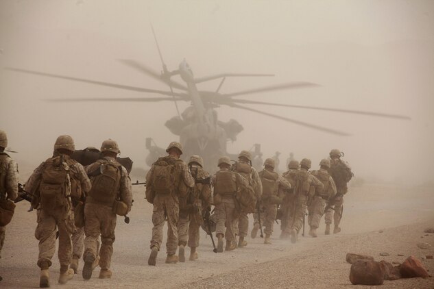 Marines with Fox Company, 2nd Battalion, 3rd Marine Regiment, load onto a CH-53E Super Stallion helicopter, Sept. 11, 2013, while conducting the air assault course as part of the Integrated Training Exercise at the Marine Corps Air Ground Combat Center Twentynine Palms, Calif. (U.S. Marine Corps photo by Cpl. Sarah Dietz)
