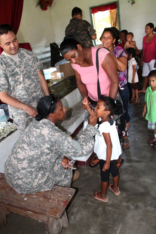 Members of Joint Task Force-Bravo's Medical Element administer medication to children during a Medical Readiness Training Exercise (MEDRETE) in Honduras, Sept. 19, 2013.  During the exercise, JTF-Bravo members provided medical care to more than 800 individuals in the Gracias a Dios region of Honduras.  (Photo by U.S. Army Spc. Patrick Rawlings)