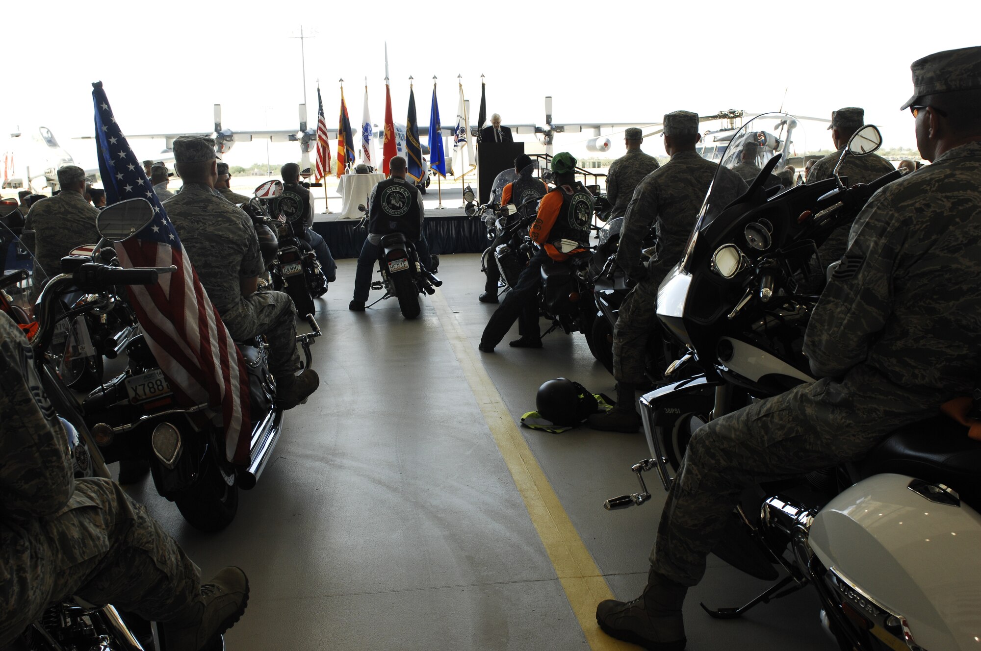 Mr. John Swett, former prisoner of war, shares his story with the Desert Lightening Team, veterans, and fellow POWs during the POW/MIA ceremony at Davis-Monthan AFB, Ariz., Sept. 20, 2013. About 50 individuals, Airmen and veterans, volunteered to ride their motorcycles in honor of those who were and are captured or missing in action. (U.S. Air Force Photo by Staff Sgt. Courtney Richardson)