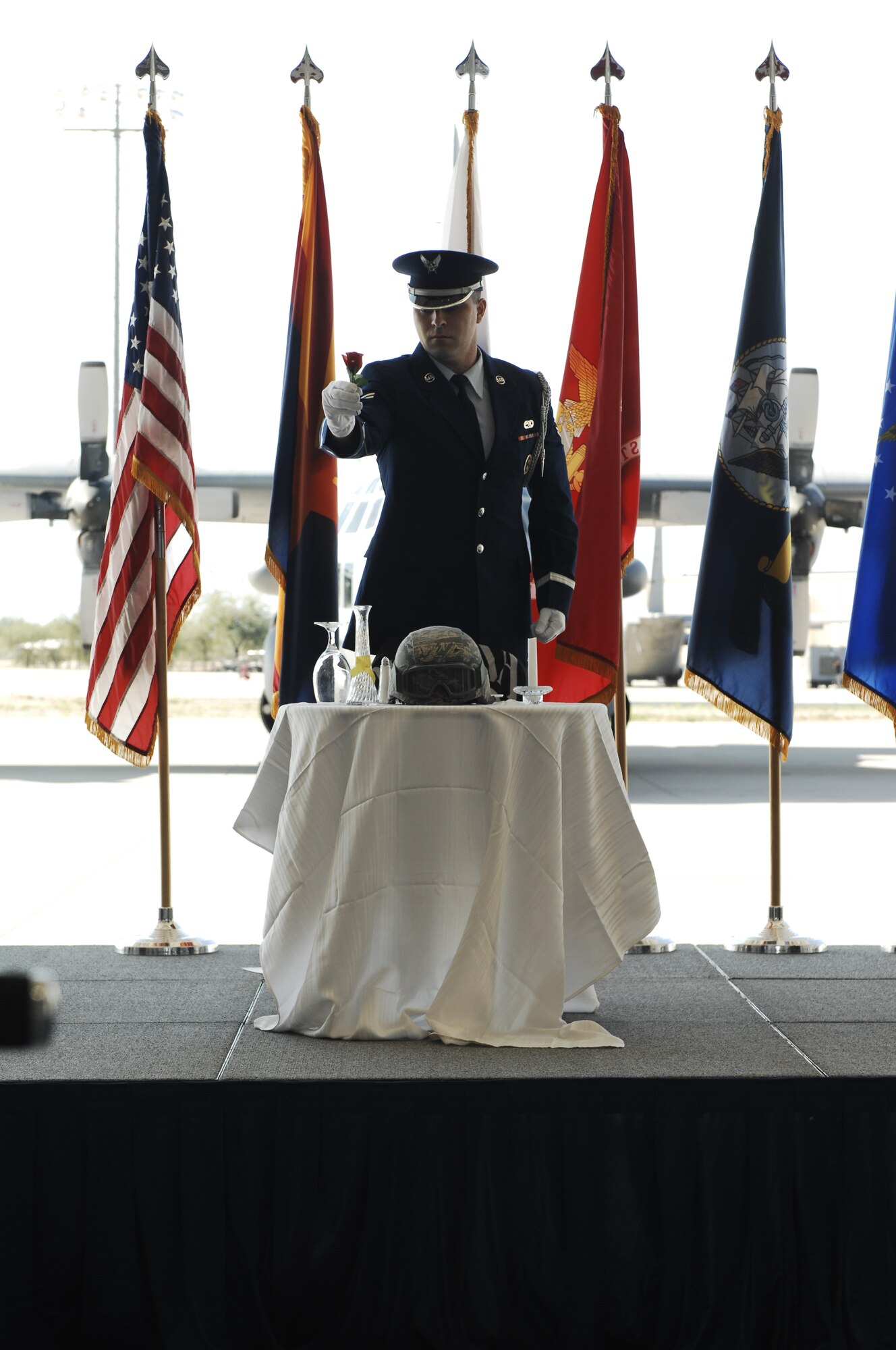 A1C Michael Letendre, 355th Force Support Squadron honor guardsman, holds a single red rose during the POW/MIA ceremony at Davis-Monthan AFB, Ariz., Sept. 20, 2013. The rose represents the family and friends of our warriors who keep faith while waiting for their loved ones safe return. (U.S. Air Force photo by Staff Sgt. Courtney Richardson)