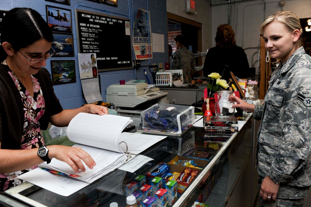 Airman 1st Class Darci Brown, 28th Comptroller Squadron financial management analyst, with a purchase in the B-One Yard store on Ellsworth Air Force Base, S.D., Sept. 17, 2013. Located in Building 3602, on Spaatz Drive, the store is open Mondays from 9 a.m. to noon and 5 to 7 p.m., Tuesdays from 9 a.m. to 2 p.m., Thursdays from 9 a.m. to noon, and Fridays from 9 a.m. to 2 p.m. For more information, call Brenda Eiman, B-One Yard Thrift and Consignment Store manager, at (605) 385-5383. (U.S. Air Force photo by Airman 1st Class Anania Tekurio/Released)