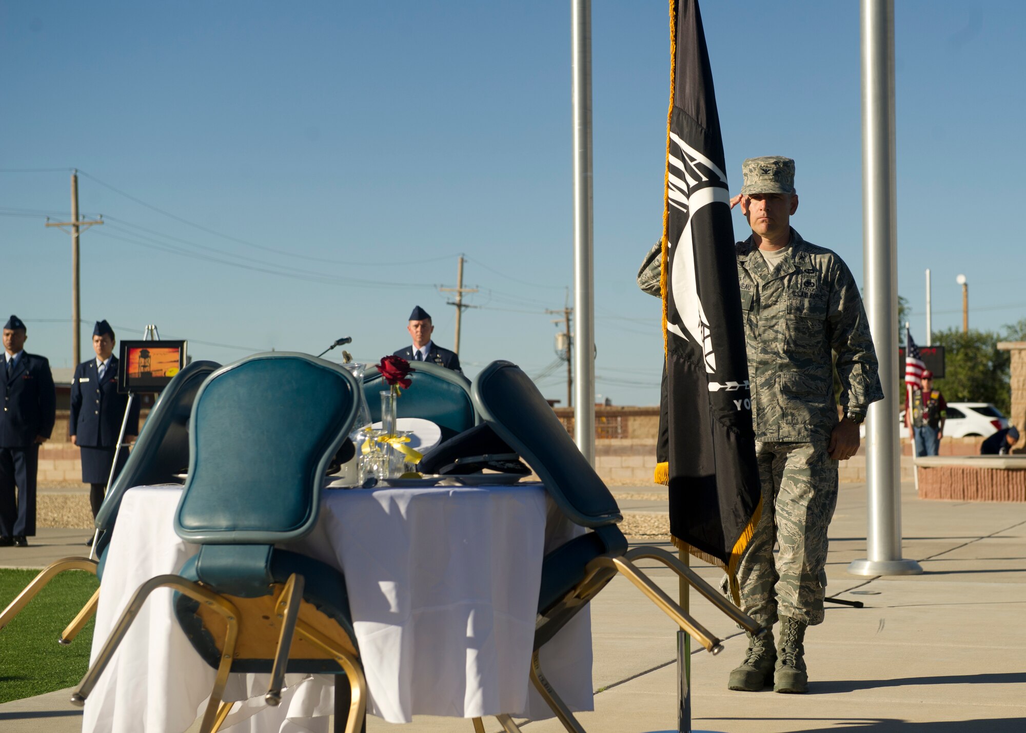 Colonel Robert Letourneau, 49th Material Maintenance Group commander, salutes the POW/MIA table after finishing the final leg of the 24-hour run in honor of the POW/MIA Day of Remembrance at Holloman Air Force Base, N.M., Sept. 20. Holloman personnel organized a 24-hour run and will hold a 24-hour vigil in honor of prisoners of war and service members missing in action. (U.S. Air Force photo by Airman 1st Class Chase Cannon/Released)