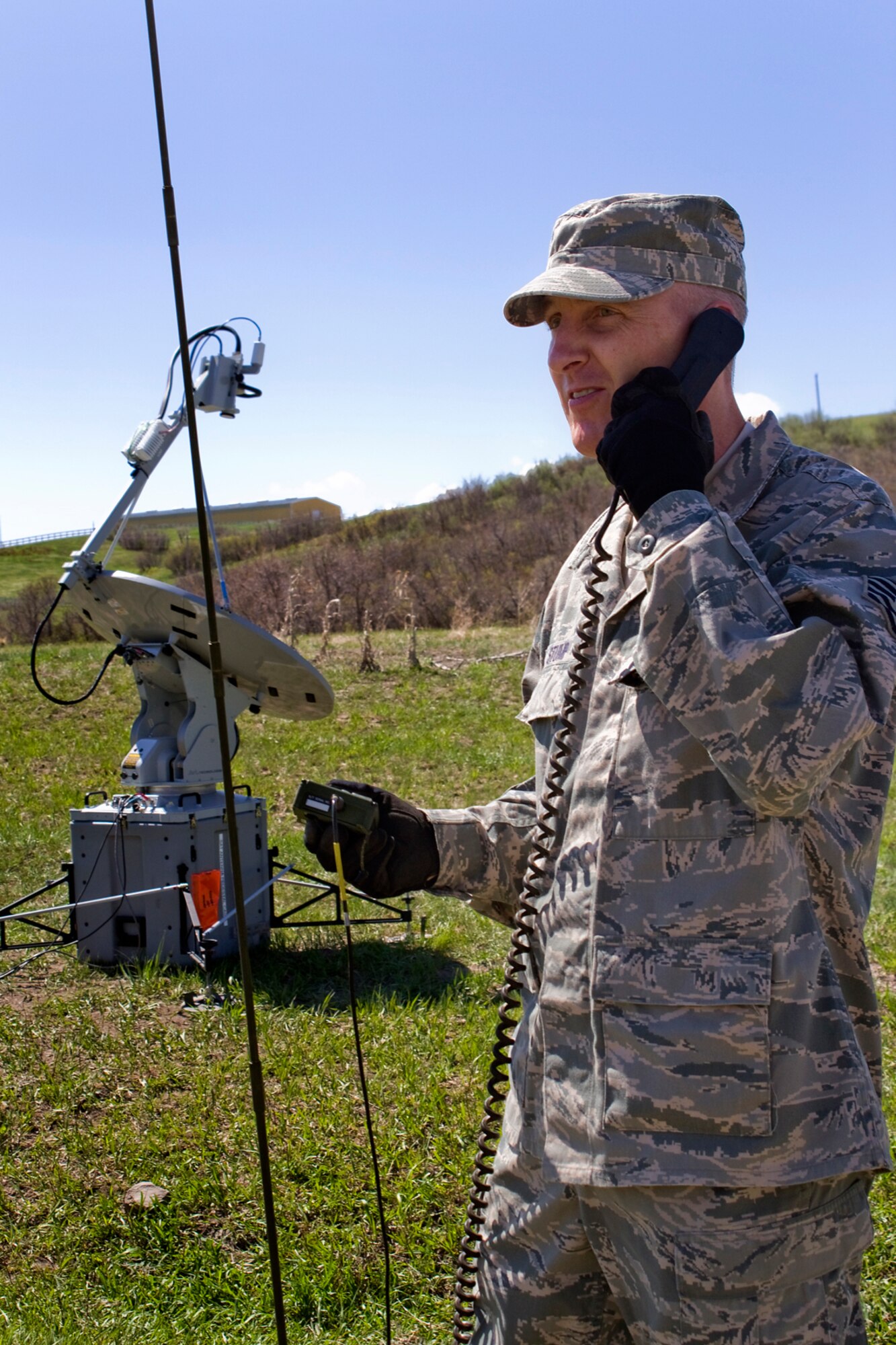 Tech. Sgt. Sean Stump, 434th Communications Squadron transmission systems noncommissioned officer in charge, uses a man-portable PRC-150 radio with a joint incident site communications capability system during Vital Connection 2013 at the Highlands Ranch Law Enforcement Training Facility in Littleton, Colo., May 16, 2013. Stump and his fellow 434th CS Airmen used the portable radio in conjunction with a JISCC system to bypass interference from power lines during the exercise. (U.S. Air Force photo/1st Lt. Dustin Schimp)
