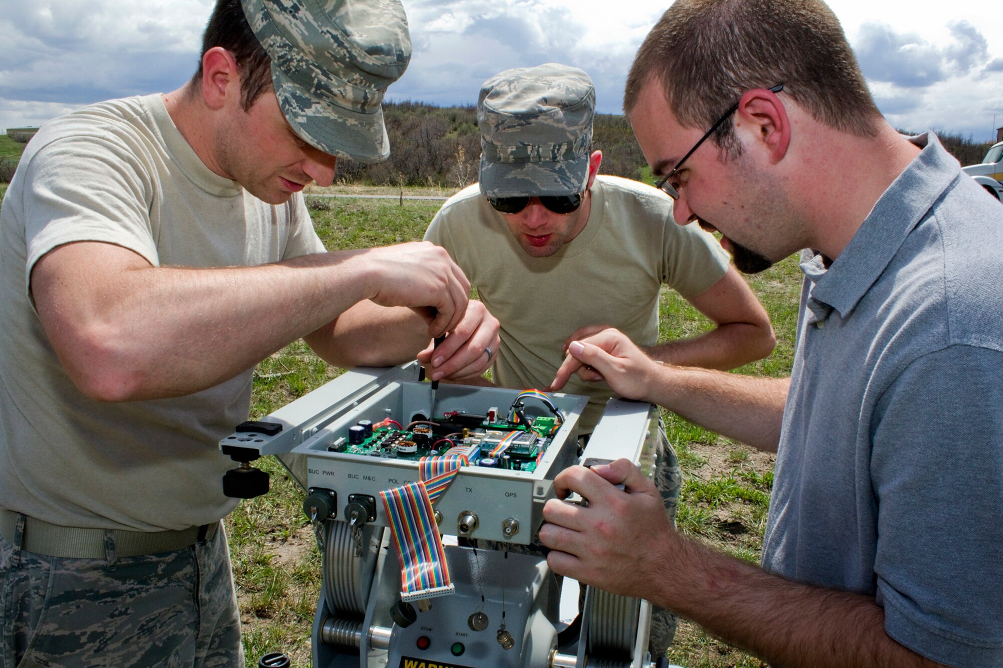 Staff Sgt. Eric L. Baker II, 434th Communications Squadron network operations technician, and Staff Sgt. Ryan Covert, 434th CS transmission systems technician, work with Scott Gray, a joint incident site communications capability system support contractor, to troubleshoot their system during Vital Connection 2013 at the Highlands Ranch Law Enforcement Training Facility in Littleton, Colo., May 15, 2013. Vital Connection 2013 is a major communications exercise sponsored by U.S. Northern Command in conjunction with the Colorado Division of Homeland Security & Emergency Management, which included various participants from state, federal and local agencies. (U.S. Air Force photo/1st Lt. Dustin Schimp) 
