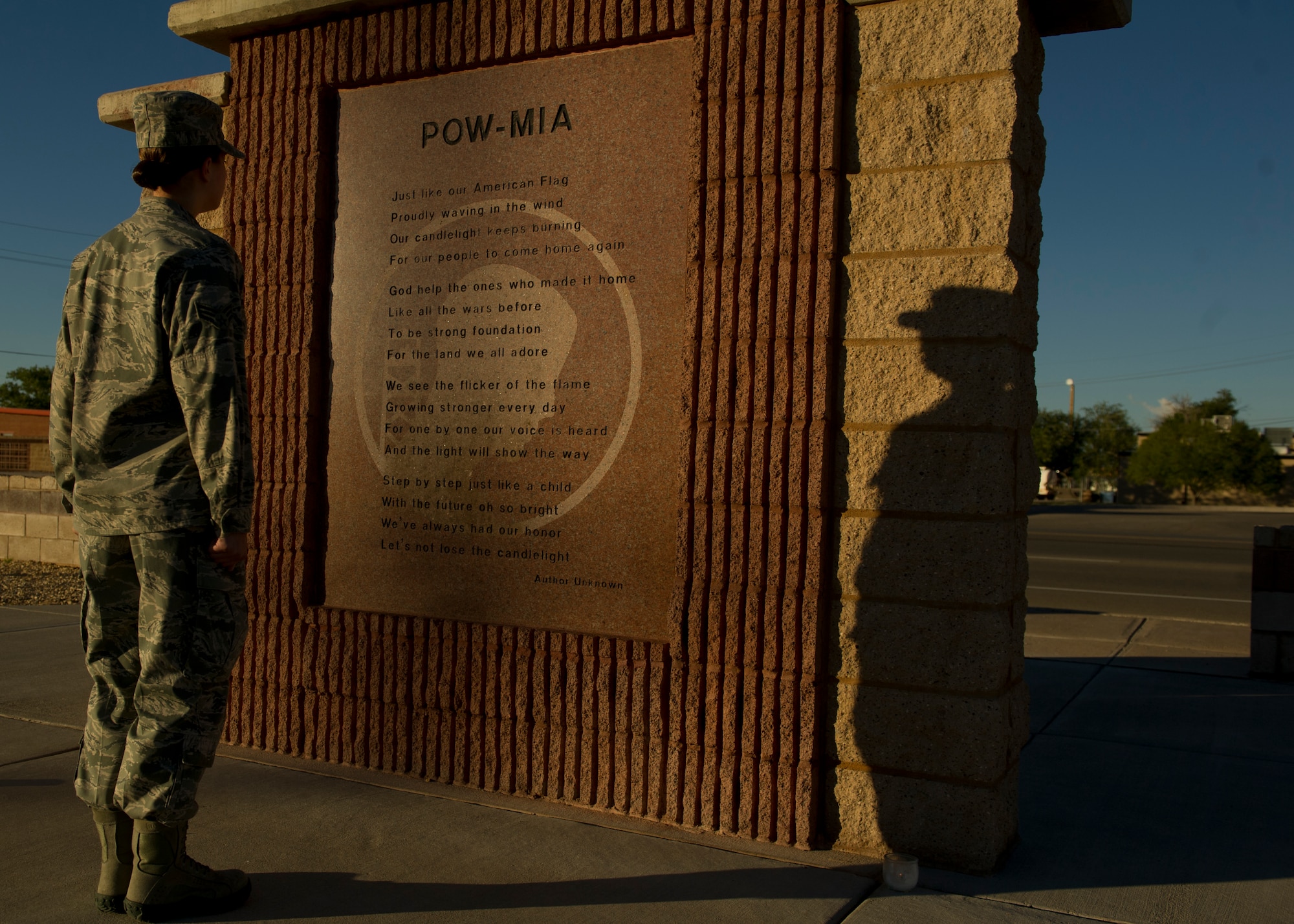 Airman 1st Class Lauren Pottmeyer, 49th Material Maintenance Group, stands in front of the Holloman Air Force Base N.M., POW/MIA memorial on Sept. 20. Pottmeyer is one of 48 Team Holloman members who volunteer to stand guard over the memorial. Holloman will hold a 24-hour vigil to honor all prisoners of war and service members missing in action. (U.S. Air Force photo by Airman 1st Class Chase Cannon/Released)