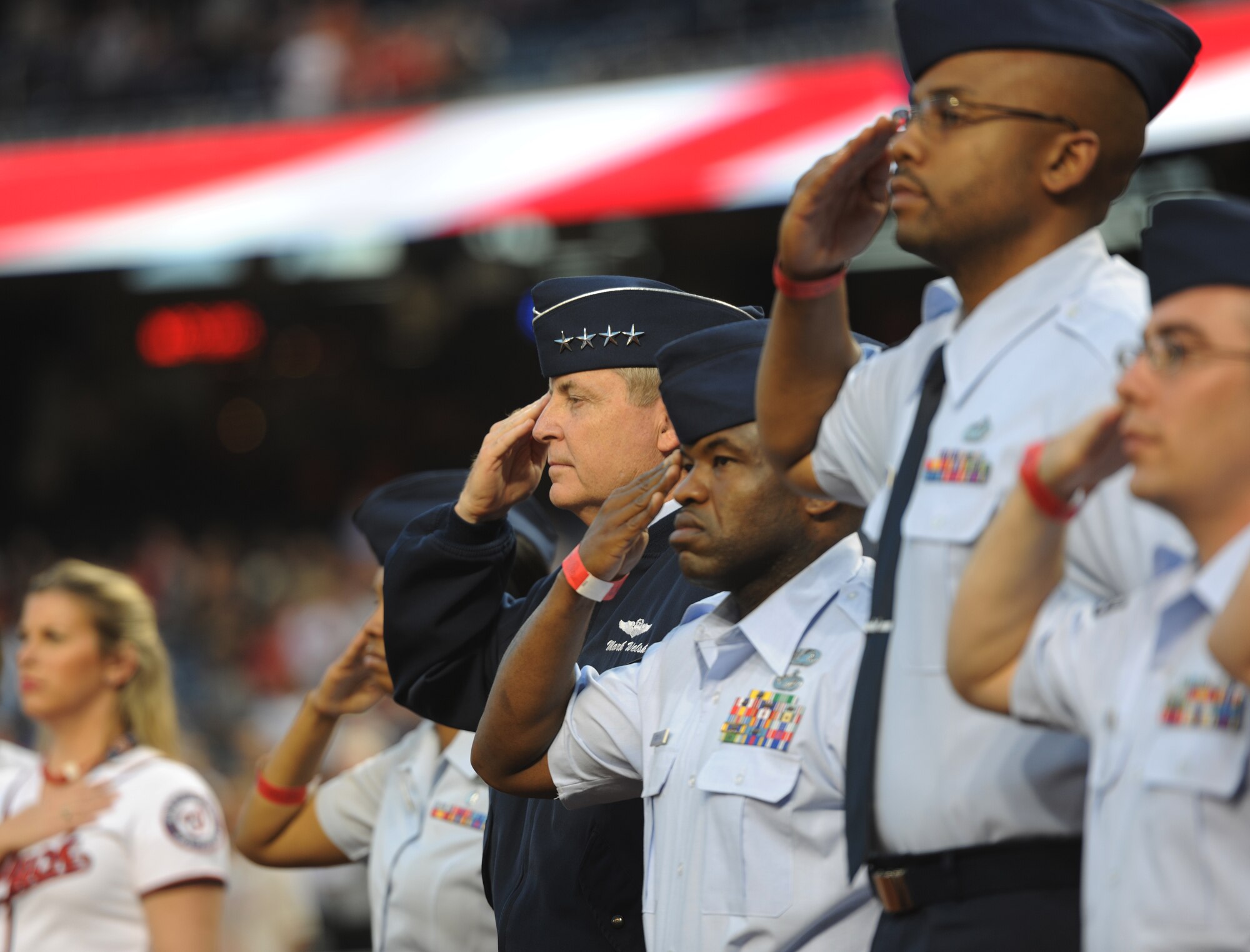 General Mark Welsh, Chief of Staff of the Air Force, stands with Airmen during the playing of the National Anthem at Nationals Park in Washington, D.C., Sept. 19, 2013. Airmen from the National Capitol Region participated in various pre-game events and ceremonies in honor of Air Force Night. (U.S. Air Force photo/Airman 1st Class Erin O’Shea)