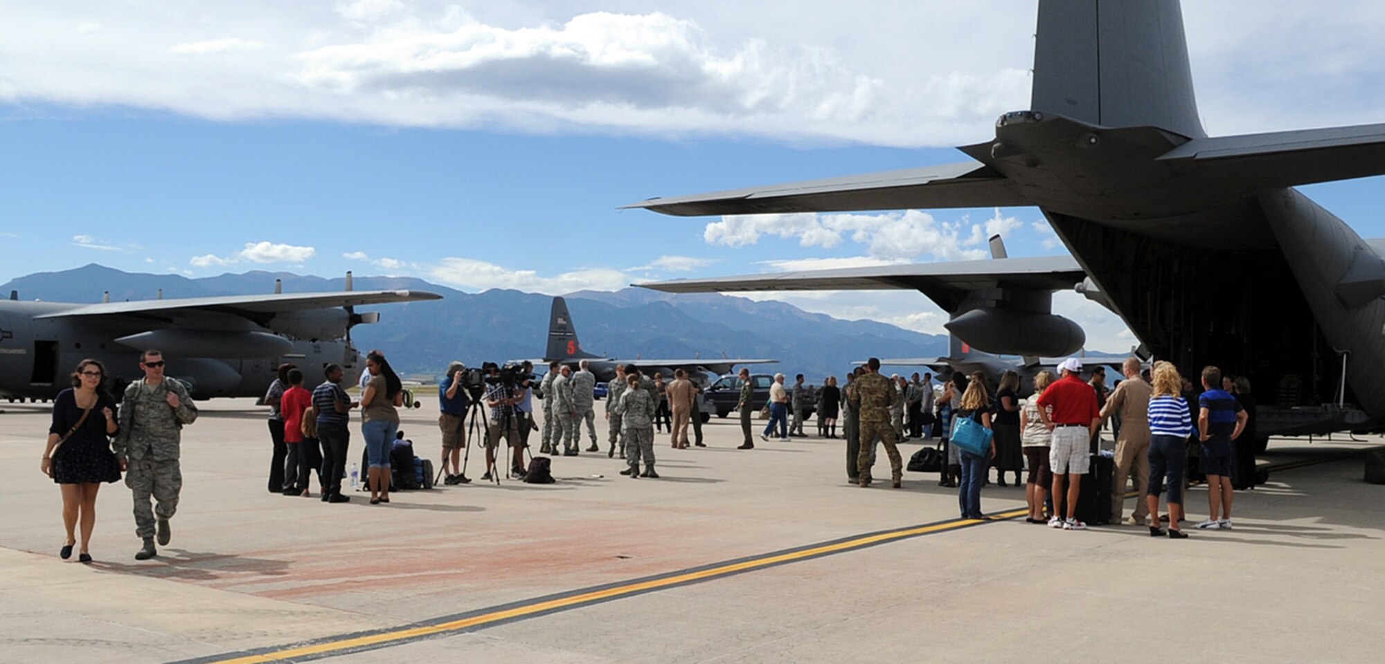 Families, friends, loved-ones and co-workers gathered to welcome home about 150 C-130 maintainers and aircrew members Sept. 18 at Peterson Air Force Base, Colo. The Reservists and Active-duty Airmen from the 302nd Airlift Wing spent four months in Southwest Asia. While deployed, members of the 302nd Operations Group flew hundreds of airlift missions moving troops, wounded warriors and cargo. The deployed members of the 302nd Maintenance Group provided aircraft maintenance support ensuring fully mission capable C-130s (U.S. Air Force photo/Rob Bussard)