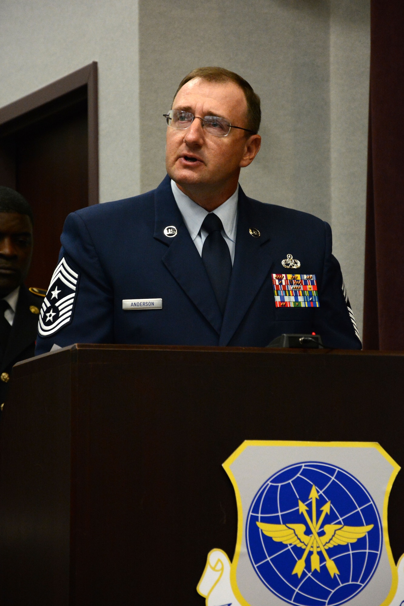 Command Chief Master Sgt. Marty Anderson reads the "The Loneliest Prayer" during the Prisoner of War and Missing in Action rememberance ceremony Sept. 20, 2013, Scott Air Force Base, Ill. The event honored the men and women who were POW or MIA during various wars. Anderson is the 375th Air Mobility Wing command chief master sergeant. (U.S. Air Force photo/Staff Sgt. Jonathan Fowler)