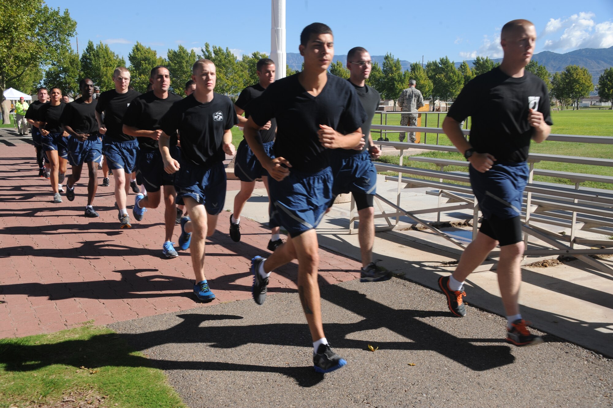 Volunteers from around the base participate in the POW/MIA vigil run at Hardin Field Sept. 20. (Photo by Todd Berenger)