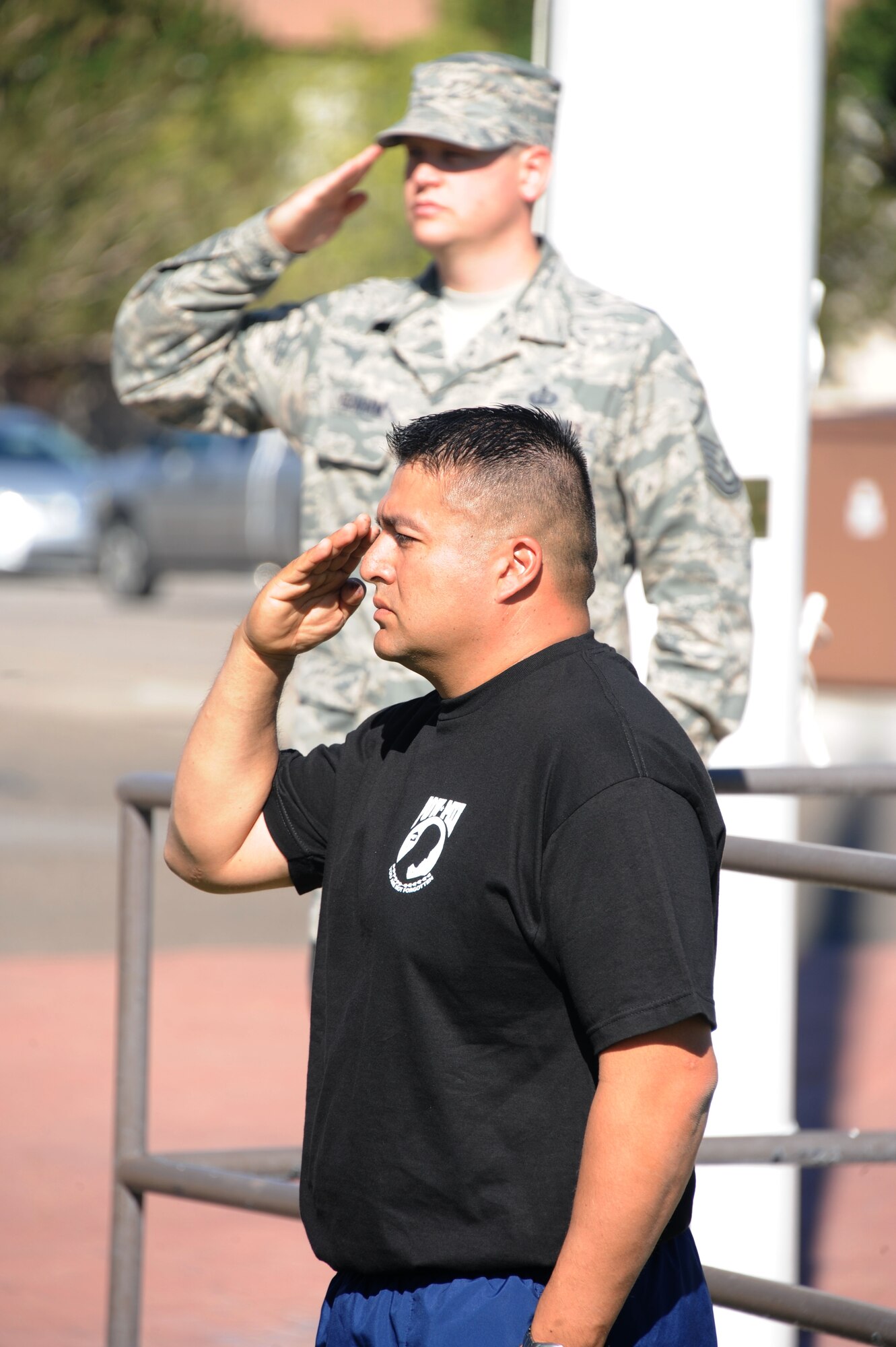 Master Sgt. Carlos Rios, 898th Munitions Squadron, salutes the flag as it passes at the POW/MIA vigil run at Hardin Field Sept. 20. (Photo by Todd Berenger)