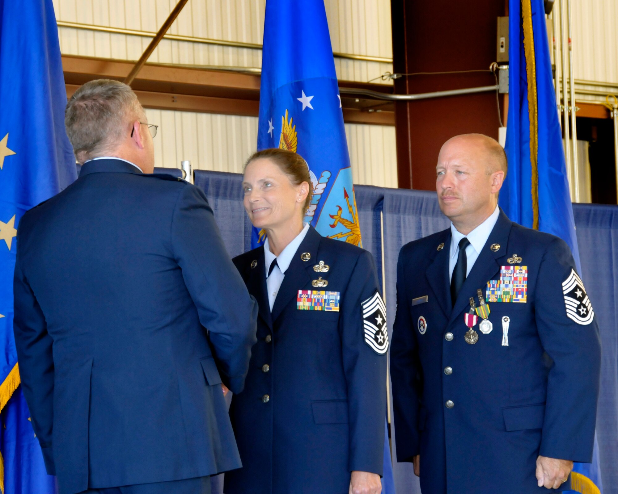 The 122nd Fighter Wing held a Command Chief change of authority and promotion ceremony, Sept 14, 2013, ushering in the unit’s first female command chief in its 67 year history. Col David L. Augustine promoted Christine A. Hutchins to Chief Master Sgt. and Chief Master Sgt. James E. Salway II passed the responsibilities of the position of the 122nd Fighter Wing’s Command Chief on to Hutchins. (U.S. Photo by Master Sgt. Darin Hubble - Released)