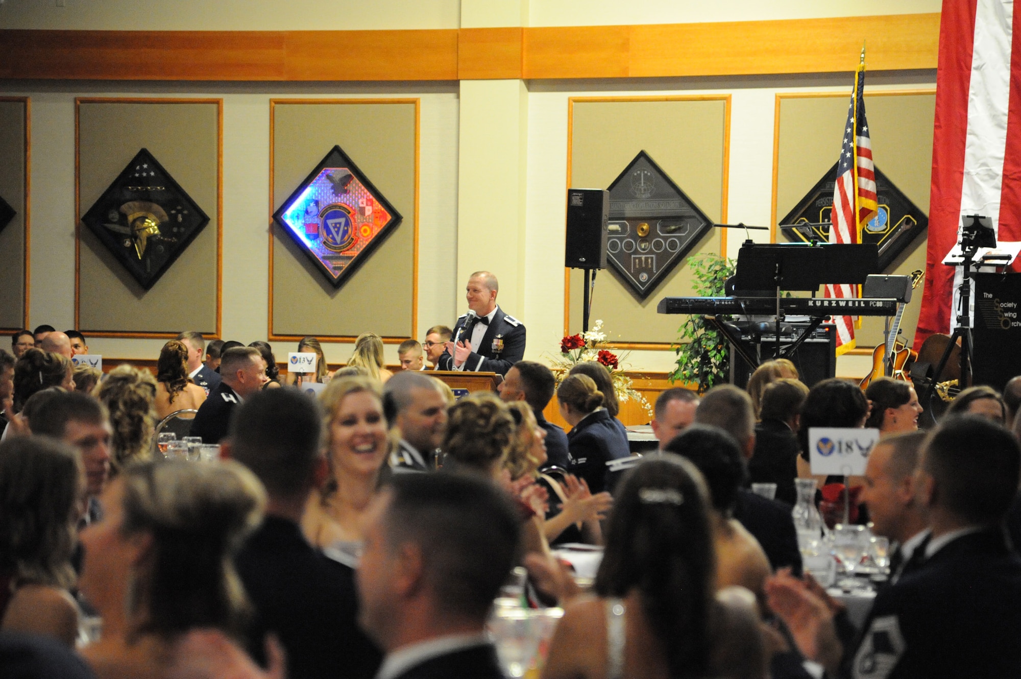 Team Malmstrom members along with friends and family applaud after a speech by Col. Robert Stanley, 341st Missile Wing commander. Attendees were asked to join him in the singing of the Air Force Song to conclude the night’s events. (U.S. Air Force photo/Airman 1st Class Collin Schmidt)