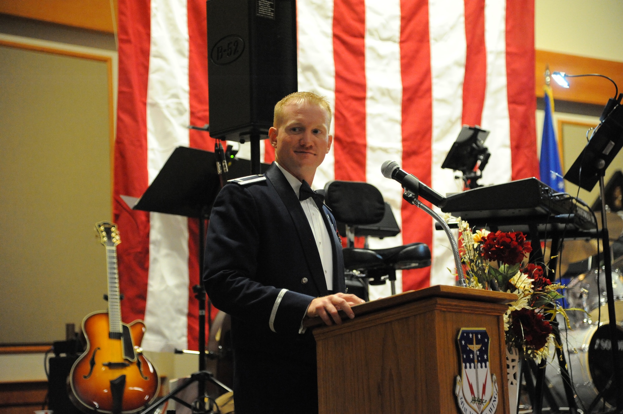 First Lt. Lee Feldhausen, 341st Operations Support Squadron ICBM instructor combat crew deputy commander, emceed the Air Force Ball. The night kicked off with a presentation of the colors and singing of the National Anthem (U.S. Air Force photo/Airman 1st Class Collin Schmidt)