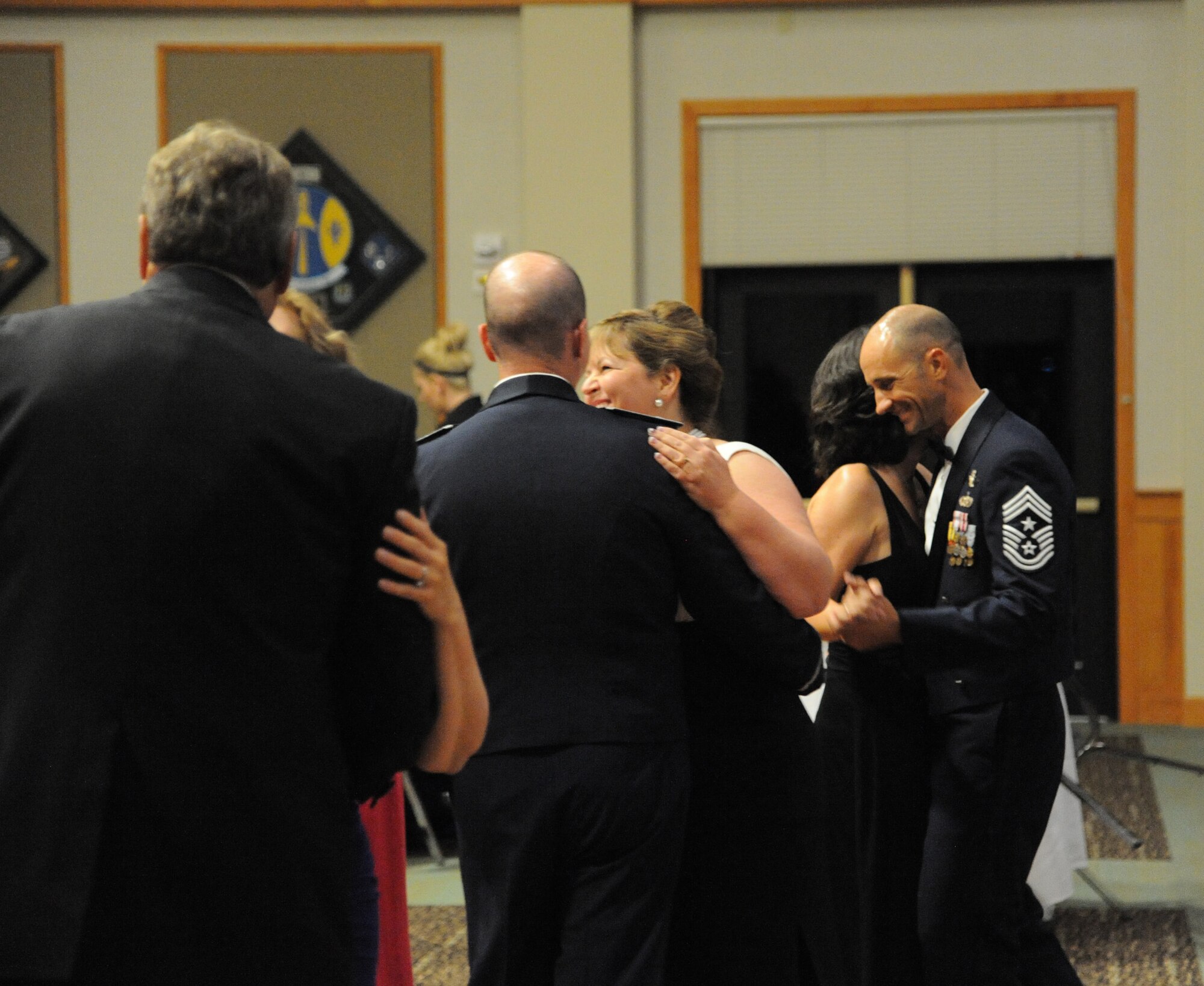 Chief Master Sgt. Frank Fidani, 341st Missile Wing command chief (far right) dances with his wife, Ellen, alongside fellow Malmstrom members. Throughout the night, guests had the opportunity to relax while enjoying the company of their fellow Airmen and friends. (U.S. Air Force photo/Airman 1st Class Collin Schmidt)