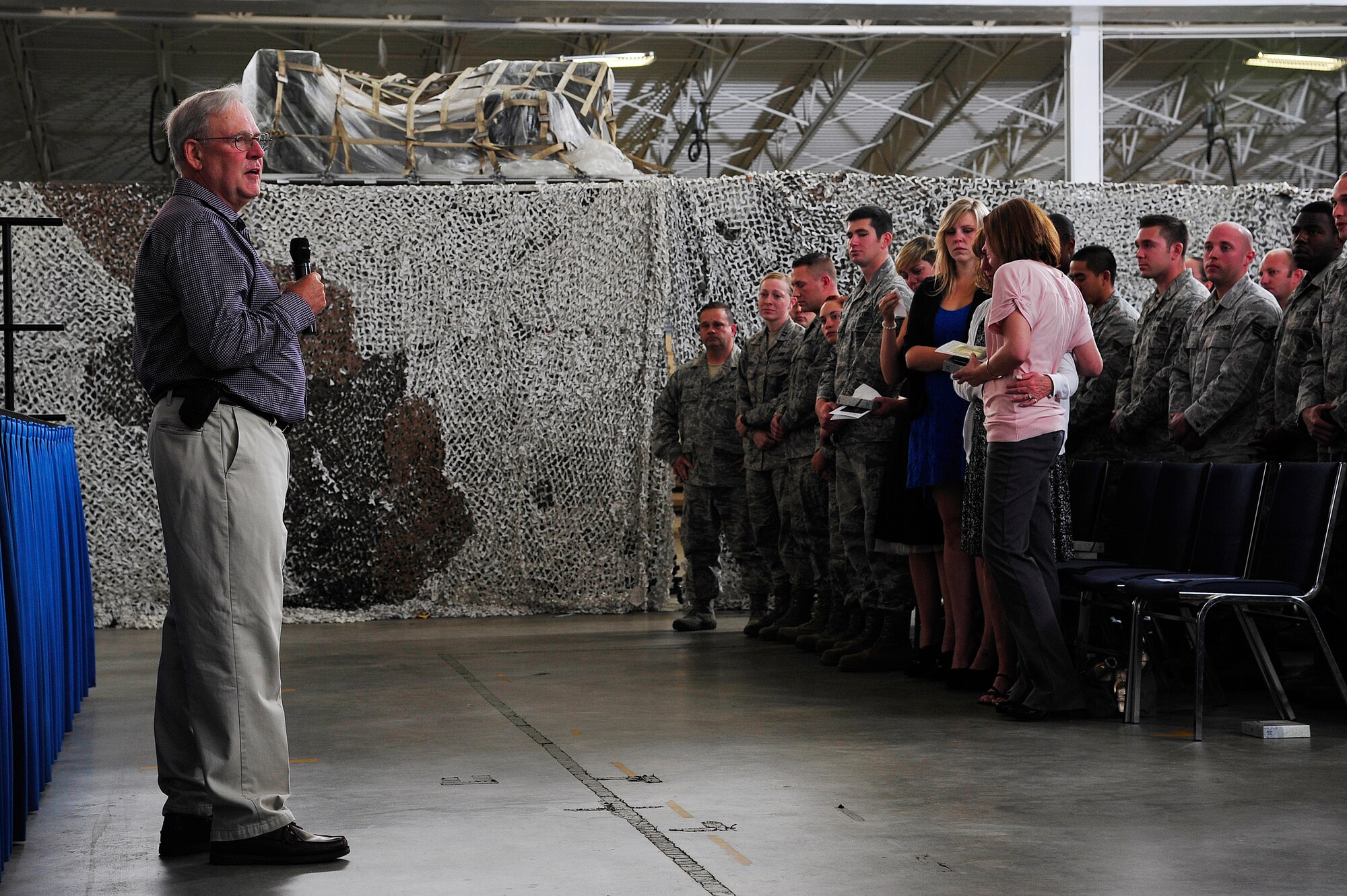 JOINT BASE MCGUIRE-DIX-LAKEHURST, N.J. -- Staff Sgt. Shuan Fischer's father, Peter, speaks during his son's memorial service at the 621st Contingency Response Wing's Global Reach Deployment Center here Sept. 20, 2013. Fischer passed away in an off-base motorcycle accident Aug. 27. (U.S. Air Force photo by Tech. Sgt. Parker Gyokeres)