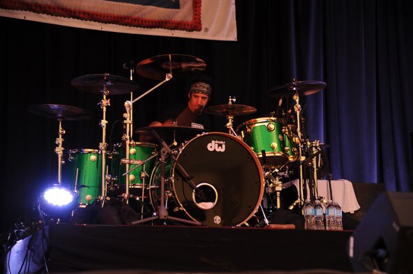 Mike Luce, a Drowning Pool member, plays the drums during a free concert for Team Malmstrom at the base theater Sept. 13. The band accepts United Service Organization tour opportunities in the U.S. and overseas in hopes to allow service members a break from their jobs. (U.S. Air Force photo/Senior Airman Cortney Paxton) 