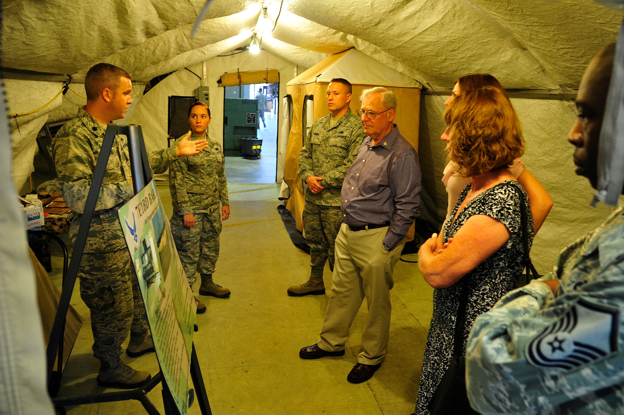 JOINT BASE MCGUIRE-DIX-LAKEHURST, N.J. -- Staff Sgt. Shuan Fischer's father, mother and sister are provided a tour of the 621st Contingency Response Wing's Global Reach Deployment Center here before attending his memorial service Sept. 20, 2013. Fischer passed away in an off-base motorcycle accident Aug. 27. (U.S. Air Force photo by Tech. Sgt. Parker Gyokeres)