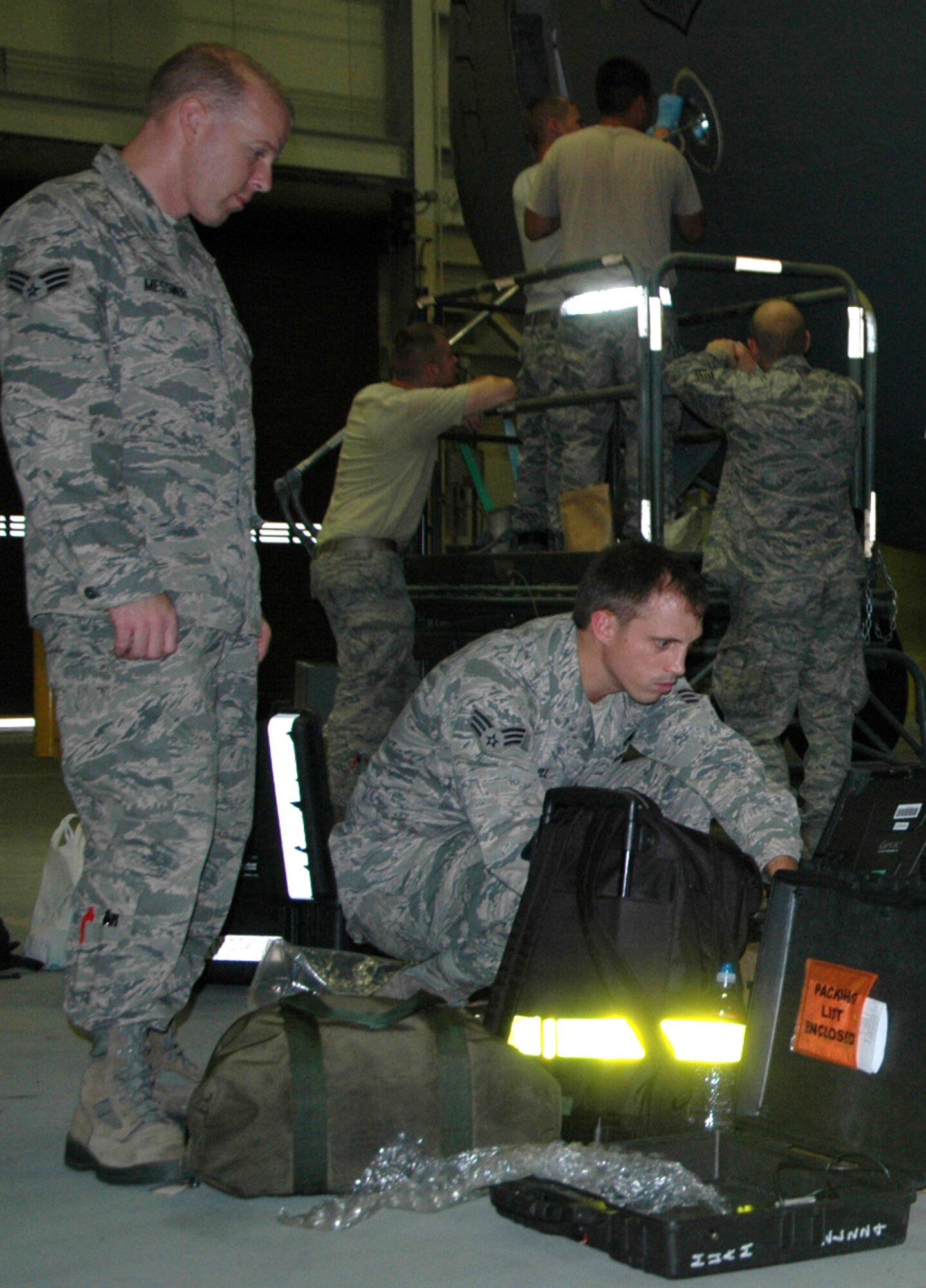 Senior Airman Lawrence Messmer, left, and Senior Airman Spencer Campbell, 446th Aircraft Maintenance Squadron, are part of the 446th AMXS Targeted Maintenance Team tackling delayed discrepancies on C-17 aircraft.  The teams of Reservists use their annual tours to help improve the health of the McChord C-17 fleet.  (U.S. Air Force Reserve photo by Sandra Pishner)