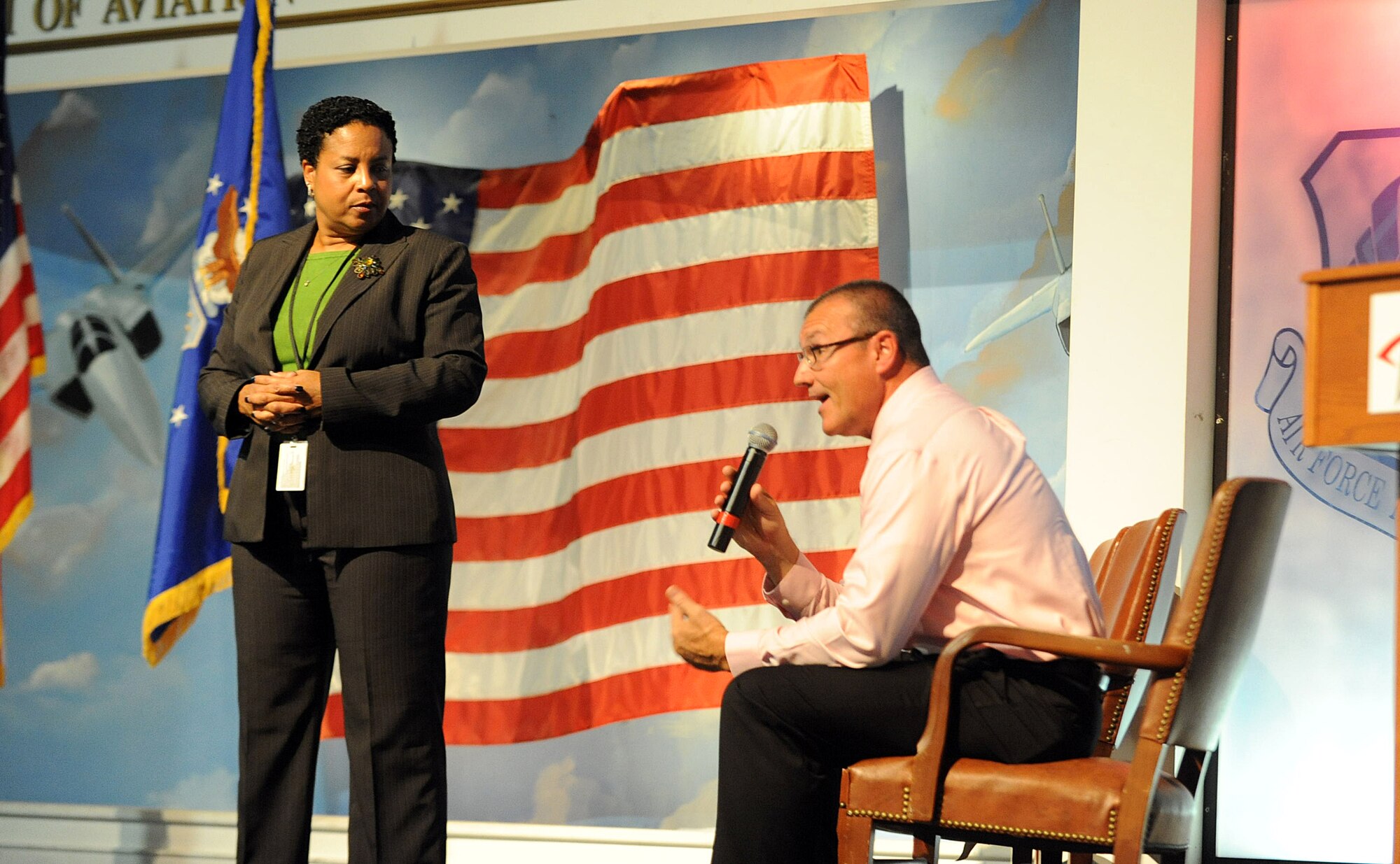 Nancy Donnelly Ivy, Air Force Security Assistance and Cooperation Policy Division chief; and Kevin Pendergast, AFSAC Financial Management Division deputy chief from Wright-Patterson Air Force Base; speak to an audience of more than 400 members of the foreign military sales community during an FMS All Call at Robins Air Force Base Sept. 11 at the Museum of Aviation. (U.S. Air Force photo by Tommie Horton)