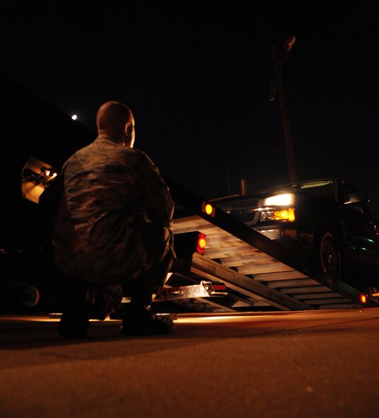Airman 1st Class Shavonte Gilbert, 2nd Logistics Readiness Squadron fuels management journeyman, drains excess fuel into a storage container at Barksdale Air Force Base, La., Sept. 16, 2013. Many units on base use night shifts to maintain the mission. The 2nd LRS uses night shifts to support Barksdale’s flying fleet with 24-hour fuel support.  (U.S. Air Force photo/Staff Sgt. Jason McCasland)