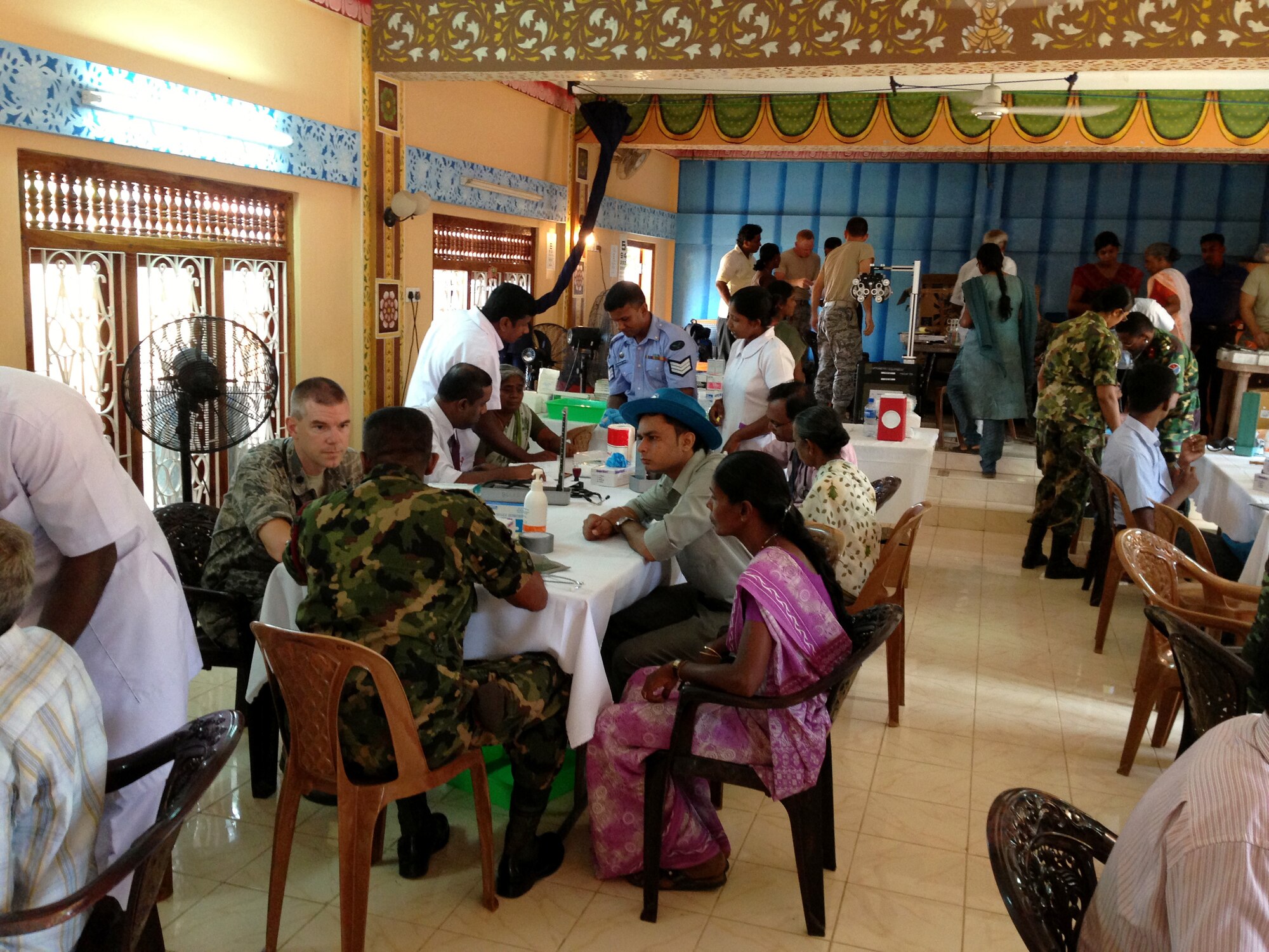 Medical personel help members recieve medical treatment during the Pacific Angel Mission in the Jaffna Peninsula of Sri Lanka, July 28- Aug.18. (Photo courtesy of Tech. Sgt. Misty Ray, 142nd Fighter Wing Medical Group).