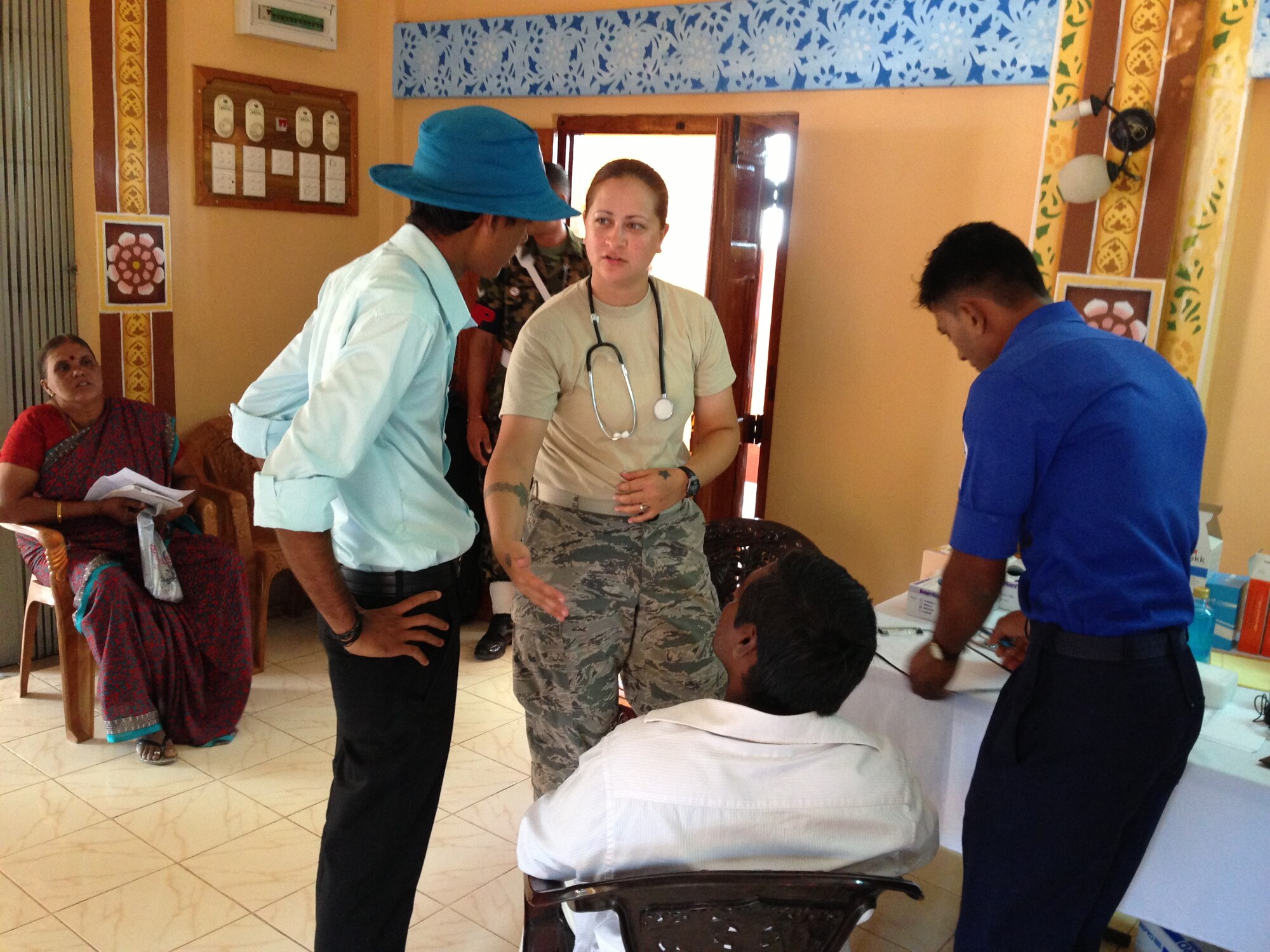 Air Force Tech. Sgt. Danielle Fahlbush, an Aerospace Medical Technician helps patients during the Pacific Angel Mission in the Jaffna Peninsula of Sri Lanka, July 28- Aug.18. (Photo courtesy of Tech. Sgt. Misty Ray, 142nd Fighter Wing Medical Group).