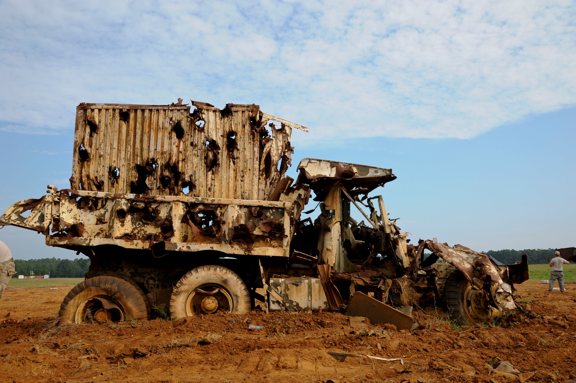 A convoy truck sits in the middle of a bomb circle  at the Claiborne Bombing and Gunnery Range in Alexandria, La., Sept. 18, 2013. The truck is used as the main target for aircraft flying above. Pilots drop BDU-12s from the aircraft in an attempt to hit the truck. Targets typically have a life span of one year or until it is completely unrecognizable. (U.S. Air Force photo/Senior Airman Joseph A. Pagán Jr.)