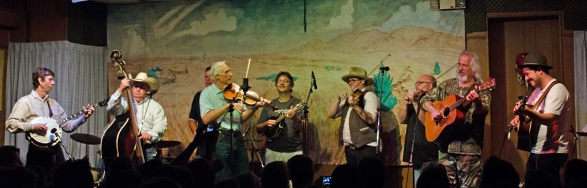 Members of The Byron Berline Band, Del McCoury Band and Mumford & Sons jammed together during the After Hours Artist Jam at the Double Stop Fiddle Shop and Music Hall Sept. 6. Upright bassist Richard Sharp, in the cowboy hat, of The Byron Berline Band also works in the 551st Commodities Maintenance Squadron. Fiddler Gregory Burgess, in the black shirt, works in the Oklahoma City Air Logistics Complex Quality Assurance Office. Also in the picture from left to right are fiddler Byron Berline of The Byron Berline Band, in the mint green shirt; Ronnie McCoury of the Del McCoury Band in the T-shirt playing the mandolin; Mumford & Sons fiddler Ross Holmes in the brown vest, and lead singer and guitarist of Mumford & Sons Marcus Mumford of in the white T-shirt and fedora. (Courtesy photo)