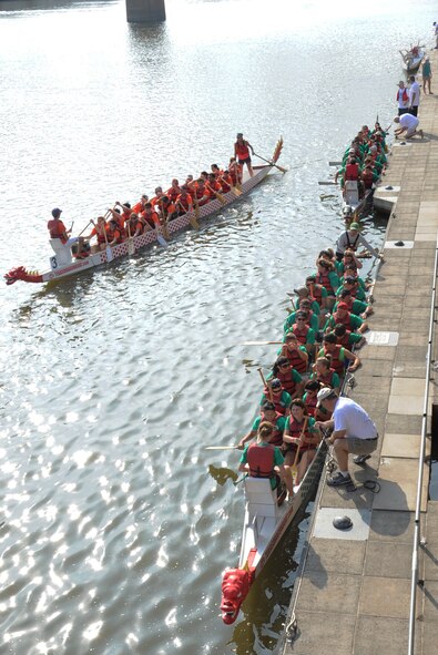 Teams participating in the 5th annual Red River Dragon Boat Festival prepare for their heat in Shreveport/Bossier City, La., Sept. 14, 2013. A typical dragon boat is about 40-feet long and consists of 10 rows of seats for 20 paddlers sitting side-by-side. (U.S. Air Force photo/Senior Airman Sean Martin)