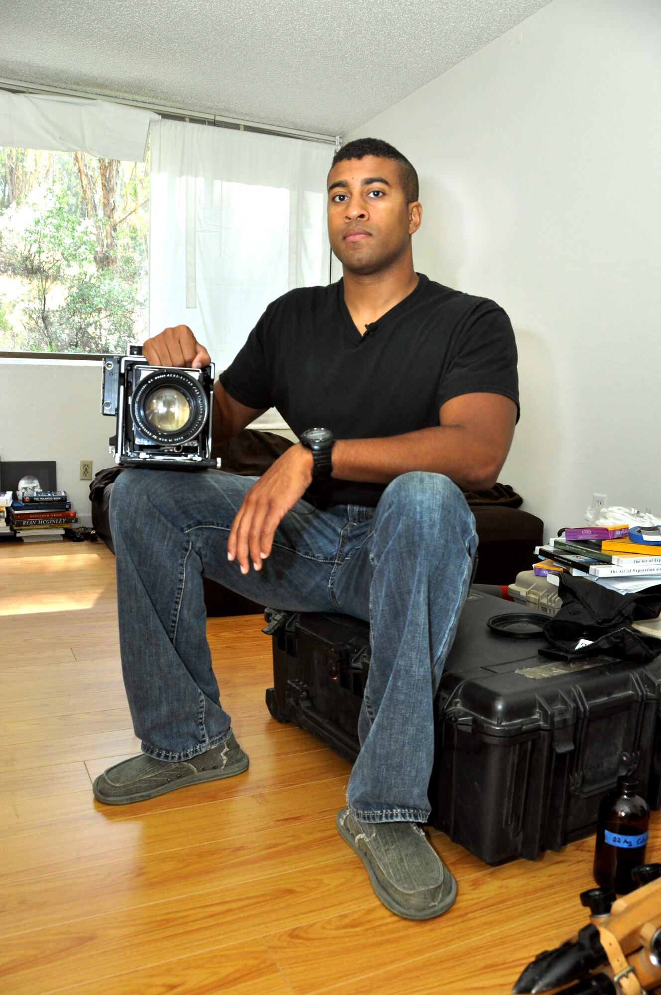 Staff Sgt. Ed Drew displays the camera he used while deployed to Aghanistan to make tin-type photos.(U.S. Air Force photo/ Staff Sgt. Patrick Harrower)