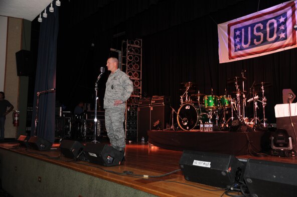 Col. Robert Stanley, 341st Missile Wing commander, welcomes Drowning Pool members as he addresses concert attendees at the base theater Sept. 13. Preparations for the band’s arrival started months ago, with Grizzly Bend staff members working to support the members’ needs during their visit. (U.S. Air Force photo/Senior Airman Cortney Paxton)