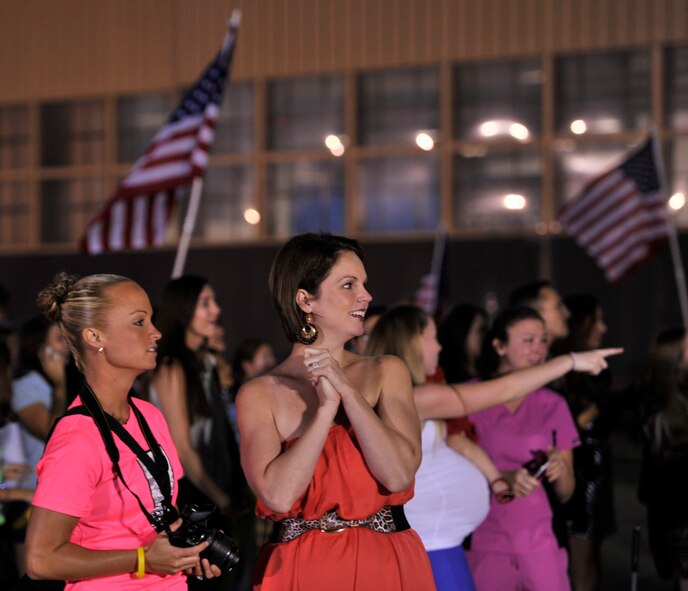 Family members watch as 20th Fighter Wing Airmen return home from a deployment, Sept. 19, 2013, Shaw Air Force Base, S.C. Airmen from the 20th Fighter Wing were deployed to Osan Air Base, Republic of Korea, for five months in an effort to bolster regional security in the region. (U.S. Air Force photo by Airman 1st Class Jonathan Bass/Released)