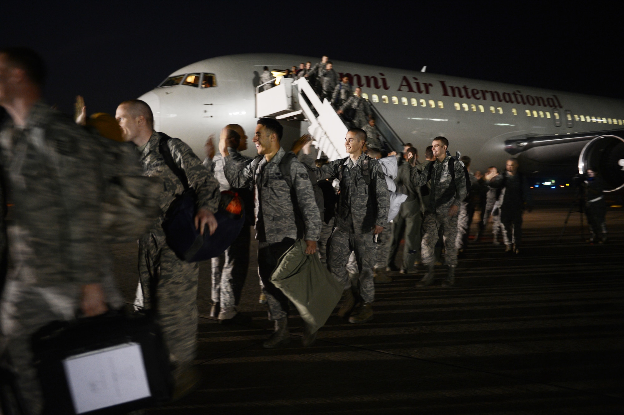 U.S. Air Force Airmen are welcomed home from Team Shaw members after a five-month deployment, Shaw Air Force Base, S.C., Sept. 19, 2013. Airmen from the 20th Fighter Wing were deployed to Osan Air Base, Republic of Korea, for five months in an effort to bolster regional security in the region. (U.S. Air Force photo by Airman 1st Class Krystal M. Jeffers/Released)