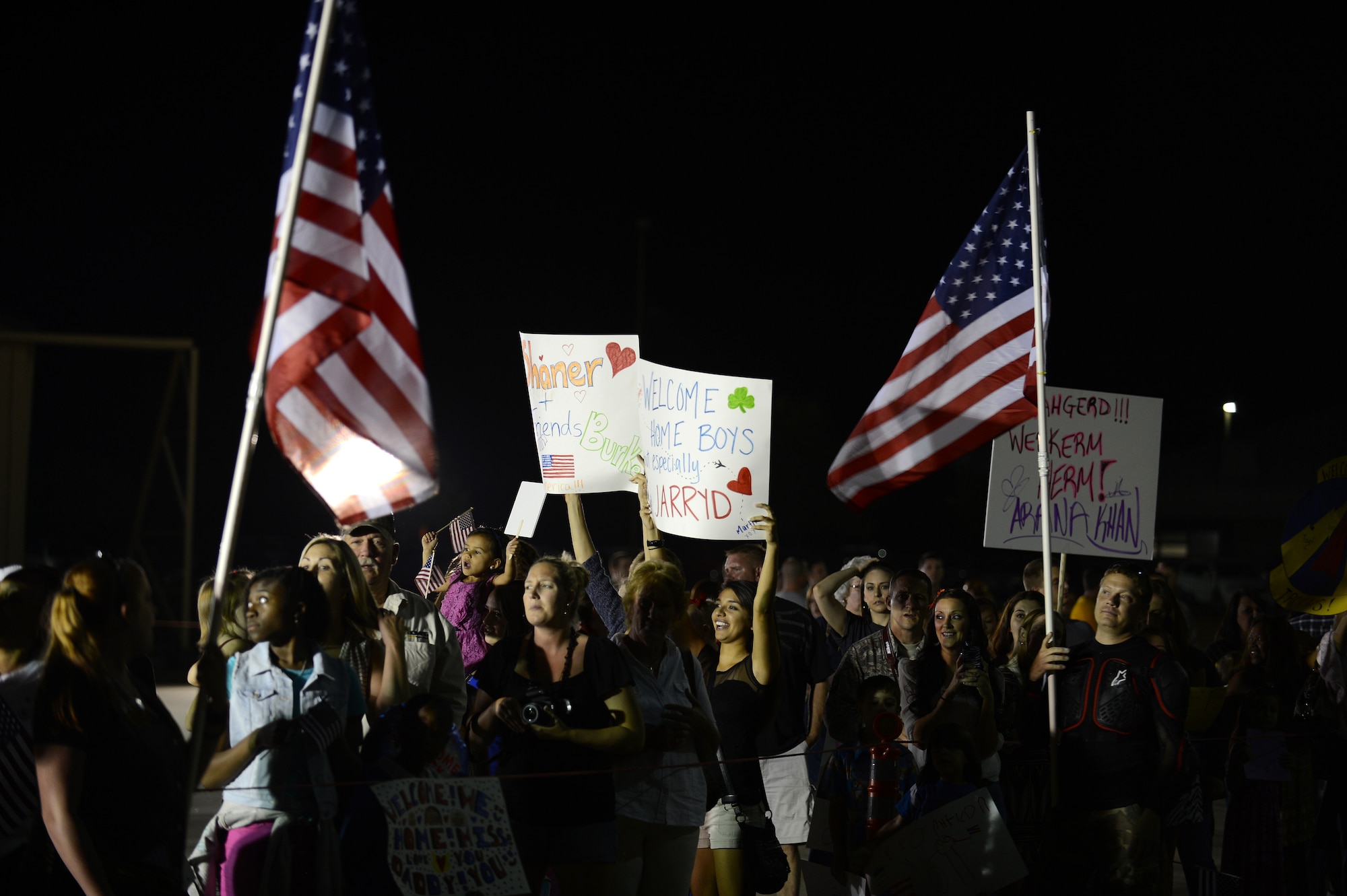 Family and friends wait for their loved ones to return from a deployment at Shaw Air Force Base, S.C., Sept. 19, 2013. Approximately 400 Airmen returned from a five-month deployment to Osan AB, Republic of Korea. (U.S. Air Force photo by Airman 1st Class Daniel Blackwell/Released)