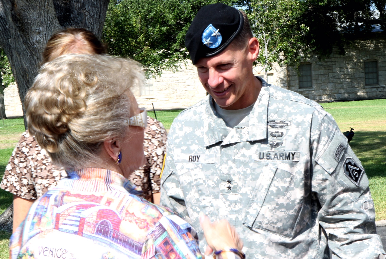 Maj. Gen. William Roy, deputy commanding general for operations, U.S. Army North (Fifth Army), chats with a member of the San Antonio community following a welcome ceremony in the Quadrangle Sept. 13. (Photo by Staff Sgt. Corey Baltos, U.S. Army North Public Affairs)