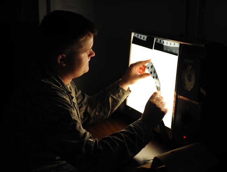 Senior Airman Joseph Freer, 2nd Maintenance Squadron non-destructive inspection journeyman, looks for cracks on flap tracks from a B-52H Stratofortress using an x-ray machine on Barksdale Air Force Base, La., Sept. 19, 2013. NDI Airmen look for cracks on parts using specialized equipment on the surface and subsurface level. (U.S. Air Force photo/Senior Airman Benjamin Gonsier)