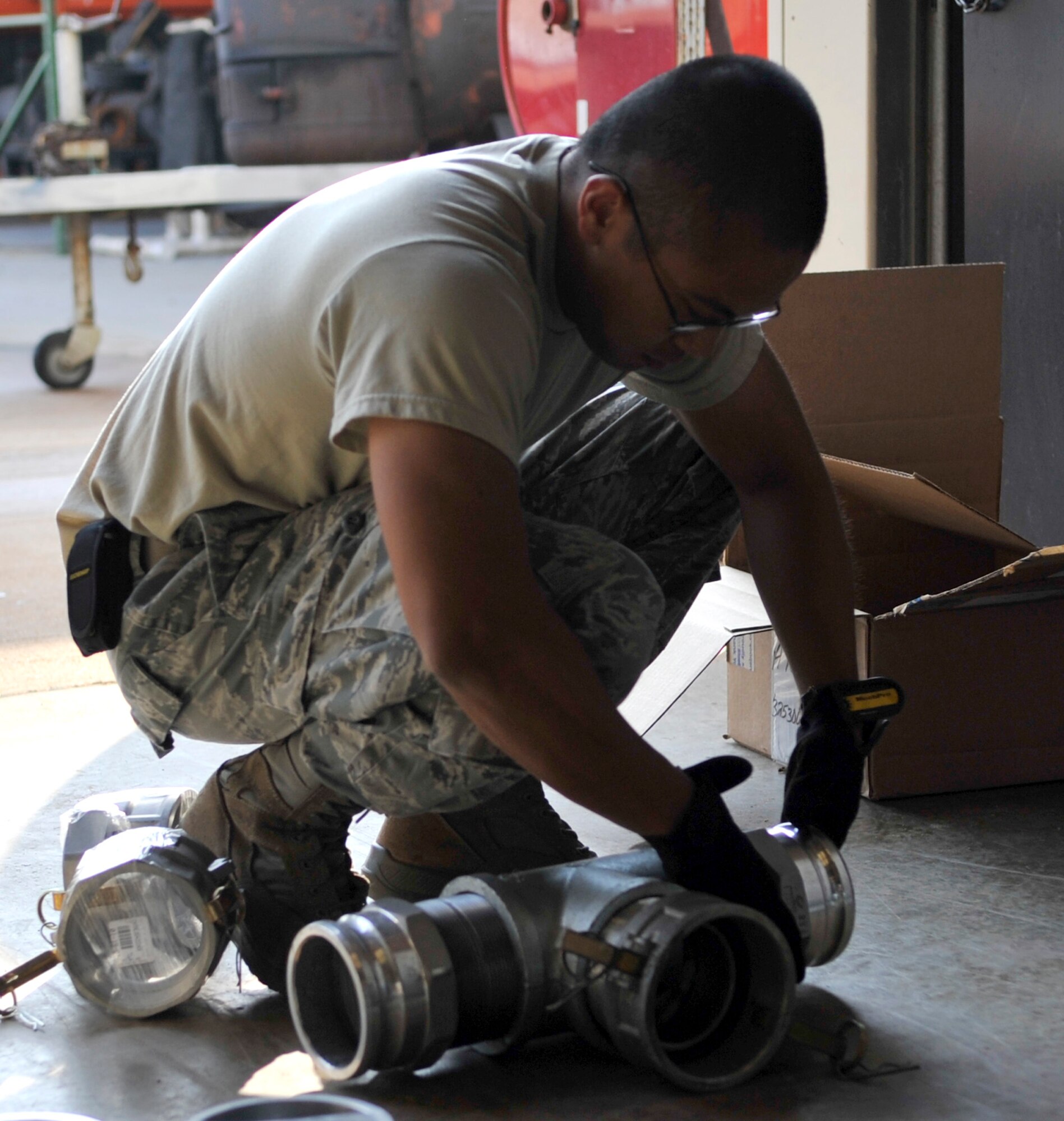 Senior Airman Jonathan Valdez, 2nd Civil Engineer Squadron water and fuels systems journeyman assembles parts to be used in a lift-station replacement on Barksdale Air Force Base, Sept. 17, 2013. The lift-station pump and metal piping will be replaced with a new unit and plastic piping. (U.S. Air Force photo/Airman 1st Class Benjamin Raughton)