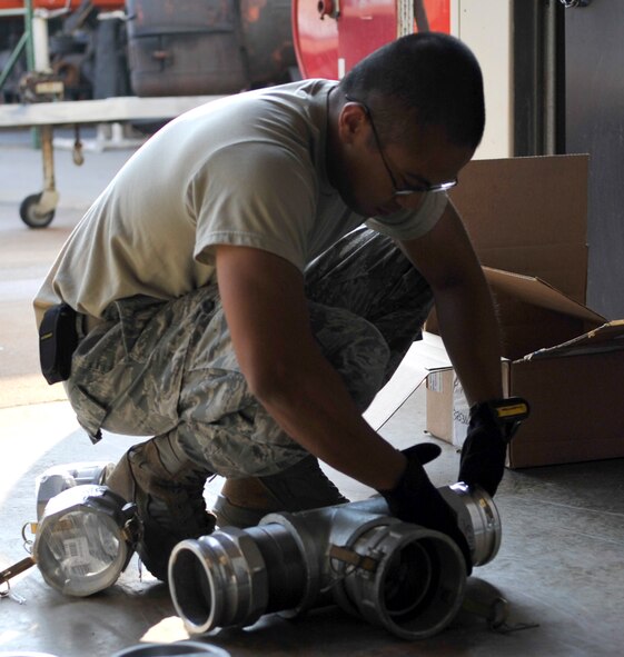 Senior Airman Jonathan Valdez, 2nd Civil Engineer Squadron water and fuels systems journeyman assembles parts to be used in a lift-station replacement on Barksdale Air Force Base, Sept. 17, 2013. The lift-station pump and metal piping will be replaced with a new unit and plastic piping. (U.S. Air Force photo/Airman 1st Class Benjamin Raughton)