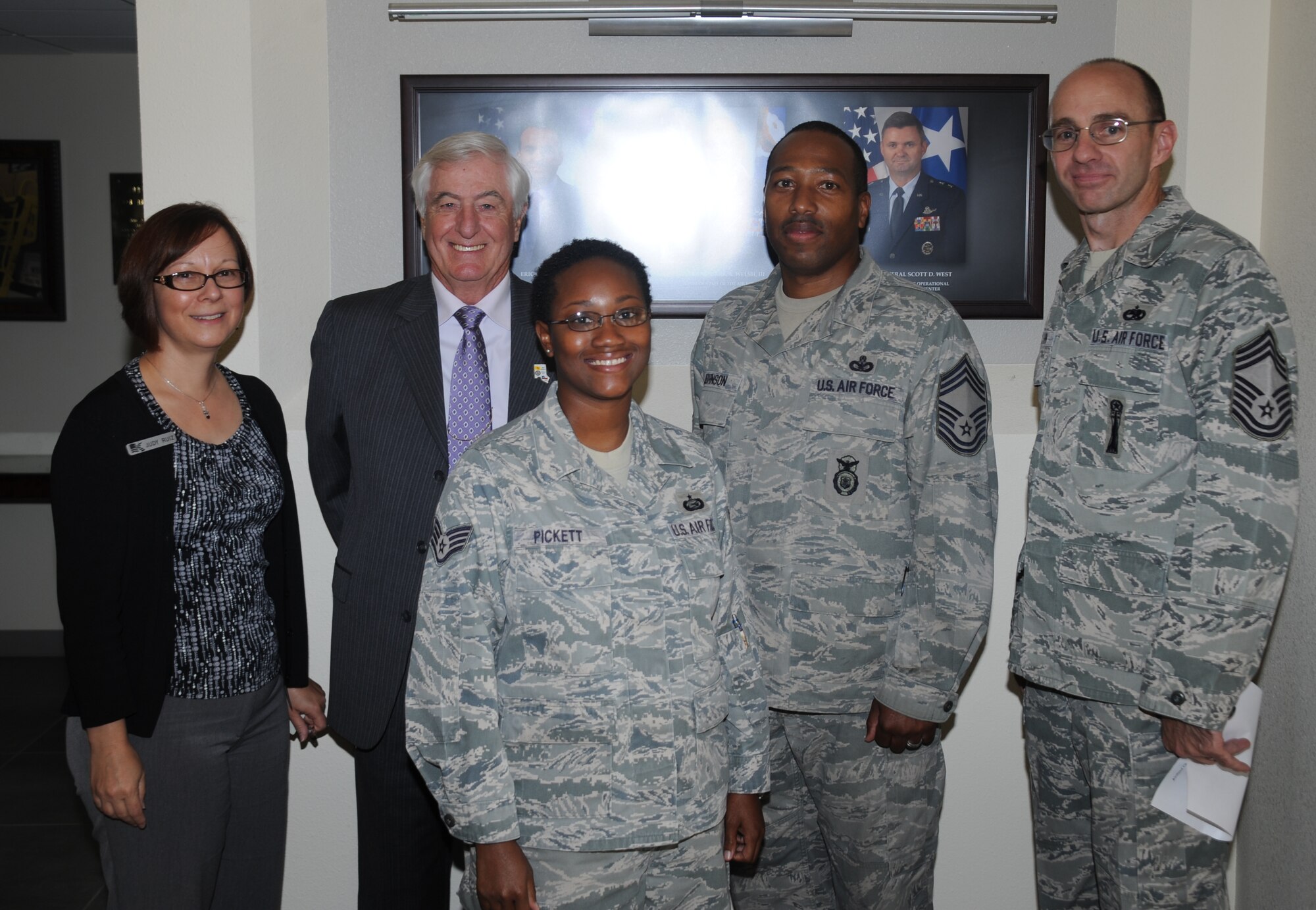 Staff Sgt. Kamesha Pickett (center), Air Force Operational Test and Evaluation Center, was selected by the Kirtland Chiefs Group as the Kirtland Sharp Troop for the month of August. She was nominated for her outstanding professionalism and accomplishments, and was presented a certificate and congratulatory letter, a Sharp Troop coin, and a $20 Visa gift card.  Pickett was also invited as the guest of honor to the Rotary Club of Albuquerque, Del Norte luncheon. (Photo by Todd Berenger)